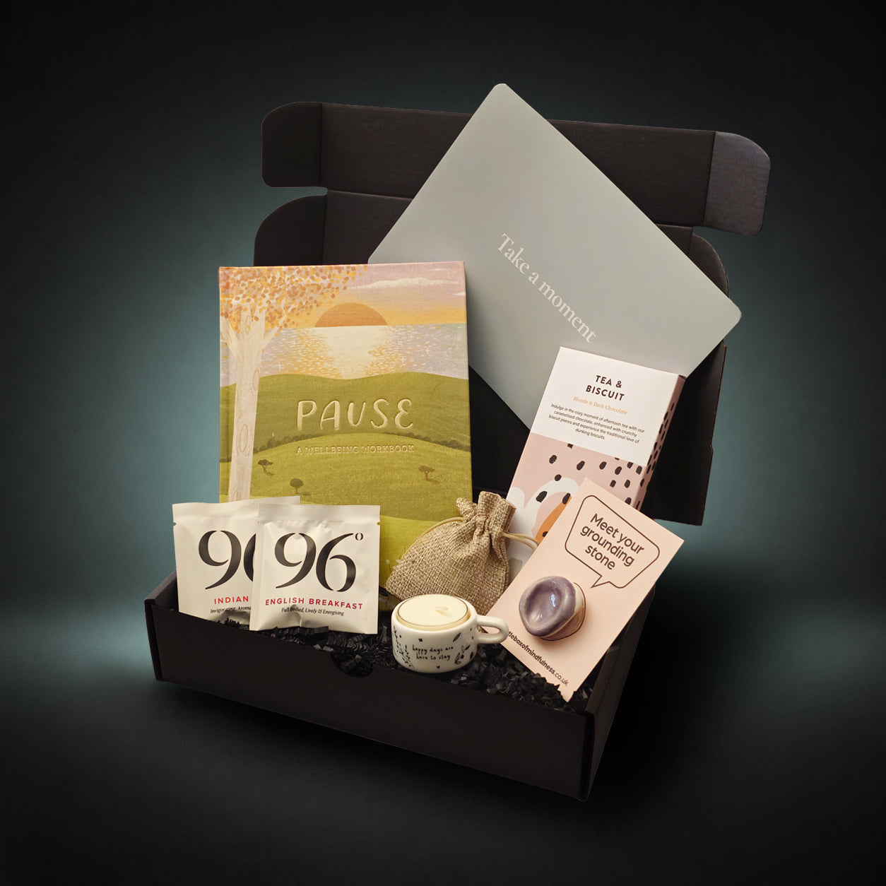 Self care gift box with wellbeing journal, grounding stone, artisan chocolate, tea, ceramic tea light holder and mindfulness gifts