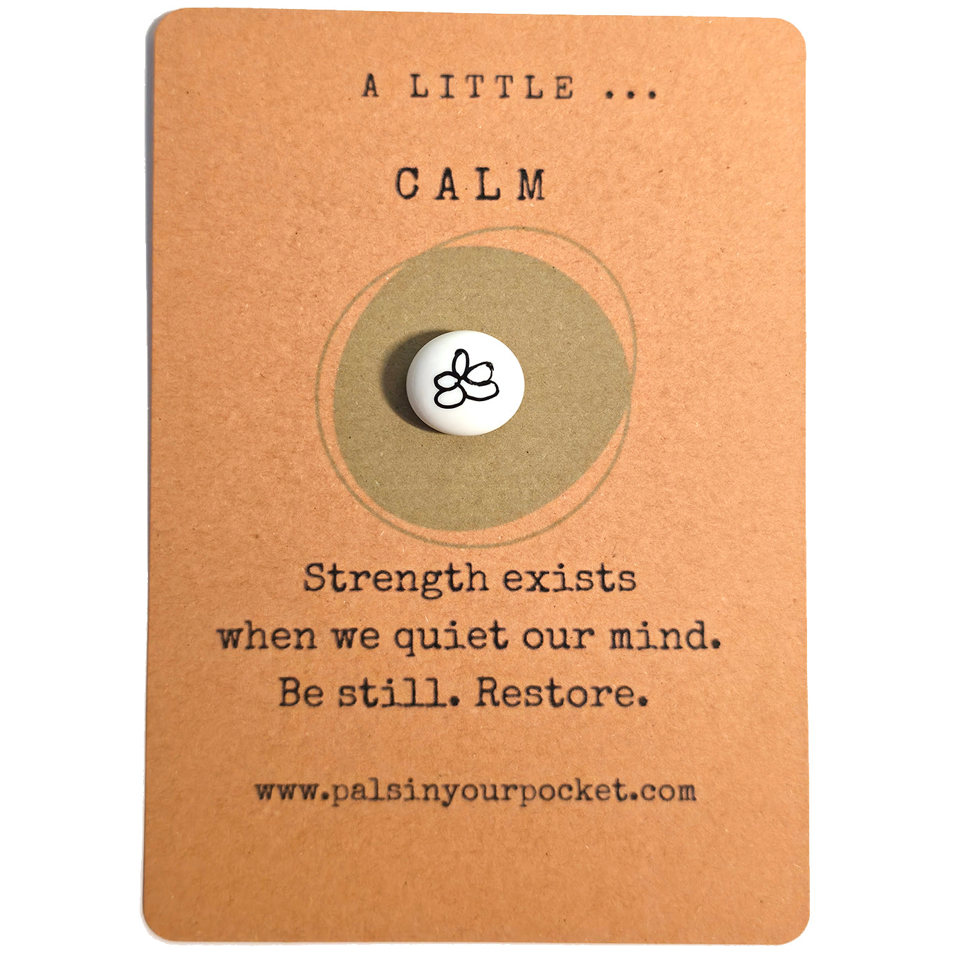 "A Little Calm” mindfulness card with a small white meditation pebble, featuring the message: “Strength exists when we quiet our mind. Be still. Restore."