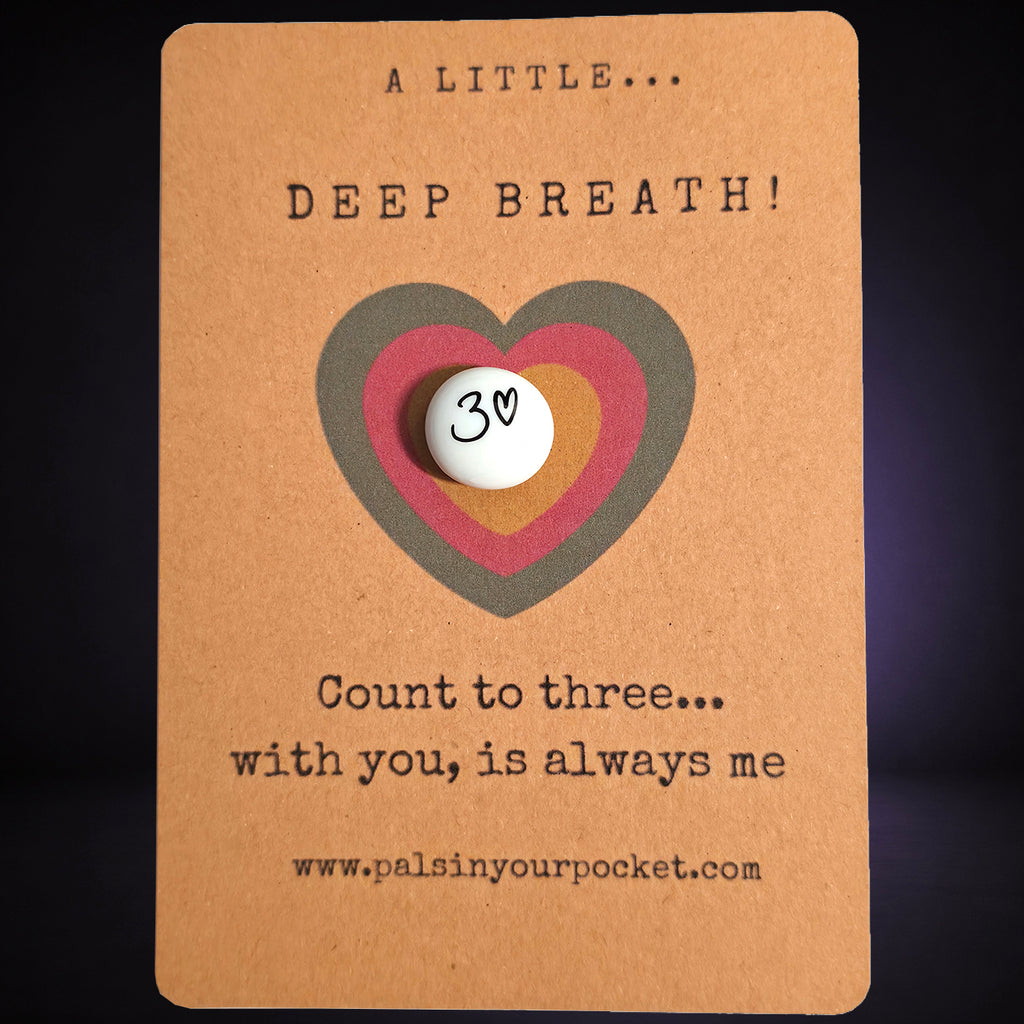 A Little Deep Breath mindfulness pebble on affirmation card encouraging calm breathing and counting to three.