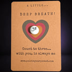 A Little Deep Breath mindfulness pebble on affirmation card encouraging calm breathing and counting to three.