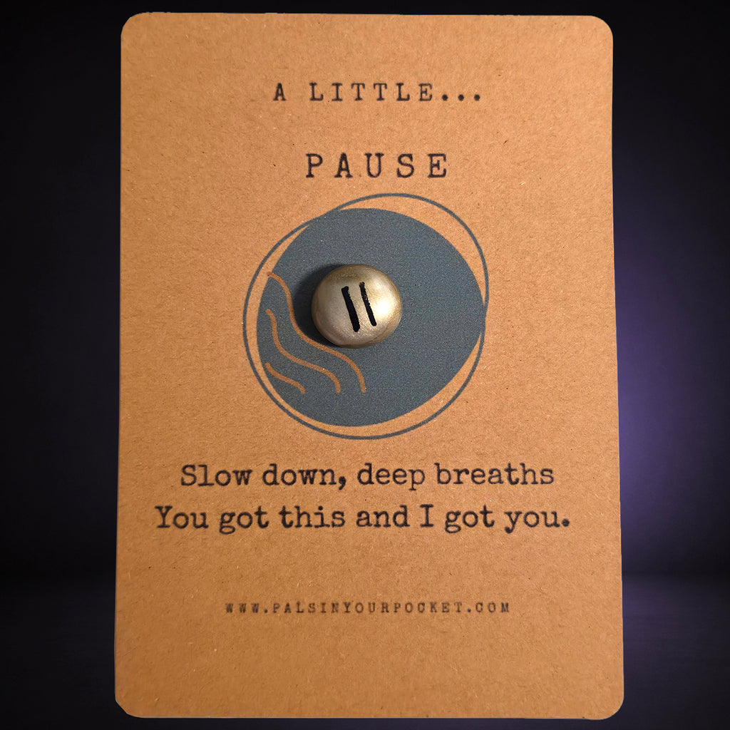 A Little Pause mindfulness pebble on affirmation card encouraging slowing down and taking deep breaths.