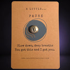 A Little Pause mindfulness pebble on affirmation card encouraging slowing down and taking deep breaths.
