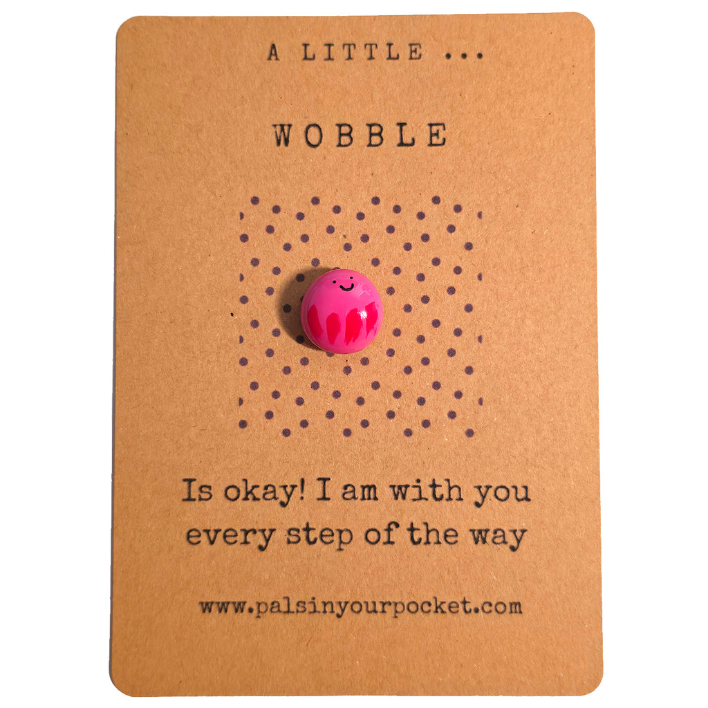 A Little Wobble mindfulness pebble on affirmation card reminding that it is okay to wobble and offering encouragement.