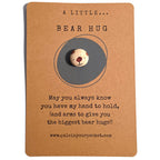 A Little Bear Hug mindfulness pebble with cute bear face on comforting affirmation card.