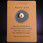 A Little Bear Hug mindfulness pebble with cute bear face on comforting affirmation card.