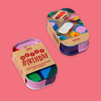 1 Block Party candle showing top and bottom of candle.  In sardine tins on a solid pink background. Cardboard sleeve that reads 'HAPPY BIRTHDAY' and 'GRAPEFRUIT & MUMBAI SOY CANDLE'.