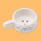 Ceramic tea light holder with "Happy days are here to stay" message