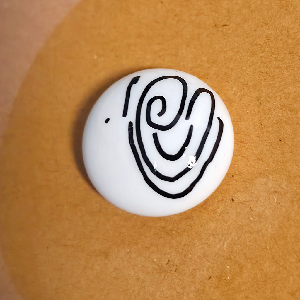 Close-up of Here For You mindfulness pebble with supportive affirmation card about being there no matter how long it takes.