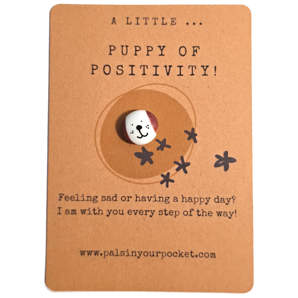 A Little Puppy of Positivity mindfulness pebble with cute dog face on affirmation card offering encouragement and support.