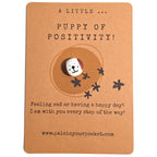 A Little Puppy of Positivity mindfulness pebble with cute dog face on affirmation card offering encouragement and support.