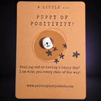 A Little Puppy of Positivity mindfulness pebble with cute dog face on affirmation card offering encouragement and support.