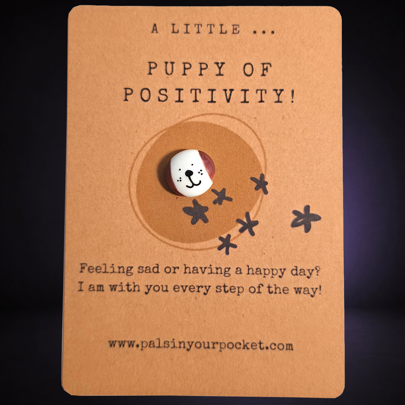 A Little Puppy of Positivity mindfulness pebble with cute dog face on affirmation card offering encouragement and support.