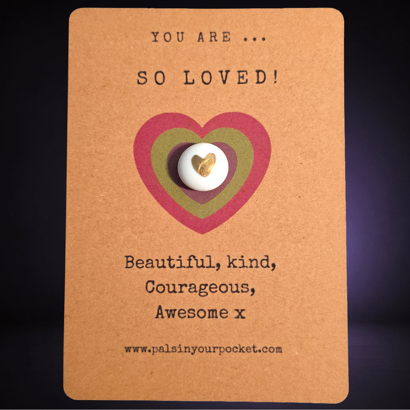 You Are So Loved mindfulness pebble with gold heart on affirmation card celebrating love and kindness.