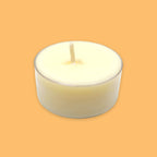 A single soy tea light candle in a clear holder, centred on a solid orange background.