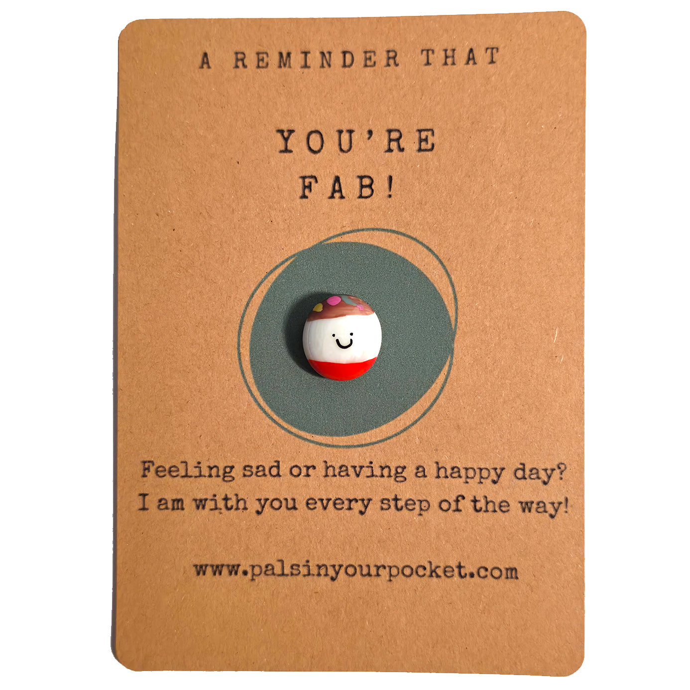 A Reminder That You're Fab mindfulness pebble with smiling face on uplifting affirmation card.
